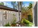 Private courtyard featuring lush tropical landscaping and a decorative fence at 672 White Pine Tree Rd # 57, Venice, FL 34285