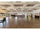 Spacious recreation room with tile flooring, modern lighting, and kitchen with an exterior view at 672 White Pine Tree Rd # 57, Venice, FL 34285