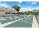 Well-maintained shuffleboard courts with clear markings, offering a classic and enjoyable recreational activity at 672 White Pine Tree Rd # 57, Venice, FL 34285