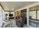 Bright sunroom with tile floors, comfortable seating, and sliding glass doors that seamlessly integrate indoor and outdoor spaces at 672 White Pine Tree Rd # 57, Venice, FL 34285