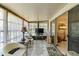 Bright sunroom with tile floors, comfortable seating, and sliding glass doors to seamlessly integrate indoor and outdoor spaces at 672 White Pine Tree Rd # 57, Venice, FL 34285