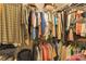 Organized walk-in closet with hanging rods and shelves to maximize storage at 672 White Pine Tree Rd # 57, Venice, FL 34285