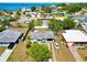 Aerial view of property near ocean, featuring a well-maintained yard, lush greenery, and neighboring homes at 6720 Northampton Pl, Bradenton, FL 34207