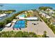 Aerial view of community amenities including pool, tennis, playground, and waterway access at 6720 Northampton Pl, Bradenton, FL 34207