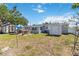 Charming backyard with storage sheds, perfect for outdoor activities and enjoying the serene setting at 6720 Northampton Pl, Bradenton, FL 34207
