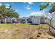 Expansive backyard with mature tree, storage shed, patio area perfect for outdoor entertaining, and lawn at 6720 Northampton Pl, Bradenton, FL 34207