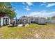 Lush backyard featuring a patio, and shed, perfect for relaxation, outdoor entertaining and storage at 6720 Northampton Pl, Bradenton, FL 34207