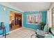Bright Florida room with turquoise walls, tile flooring, and outdoor views at 6720 Northampton Pl, Bradenton, FL 34207