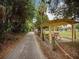 Covered picnic area near the paved walking path in a lush park setting at 6720 Northampton Pl, Bradenton, FL 34207