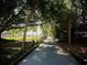 Scenic walking path lined with trees and wooden posts in a beautiful park at 6720 Northampton Pl, Bradenton, FL 34207