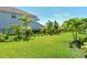 A spacious and well-kept backyard with a black fence and lush, green lawn, perfect for outdoor activities at 6800 Dunlin Ct, Sarasota, FL 34241