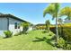 Well maintained backyard featuring lush green grass, decorative landscaping and a black fence at 6800 Dunlin Ct, Sarasota, FL 34241