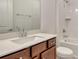 A charming bathroom features modern fixtures, vanity, tile and bright natural light at 6800 Dunlin Ct, Sarasota, FL 34241