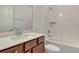 A charming bathroom features modern fixtures, a tiled shower and updated vanity at 6800 Dunlin Ct, Sarasota, FL 34241