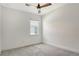 A cozy bedroom offers neutral carpet, bright natural light and fresh white paint at 6800 Dunlin Ct, Sarasota, FL 34241