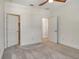 Bright bonus room with neutral carpet and white doors at 6800 Dunlin Ct, Sarasota, FL 34241