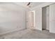 Neutral bedroom features a closet and attached bath access with modern finishes at 6800 Dunlin Ct, Sarasota, FL 34241