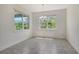 Bright dining area with tile flooring, natural light, and charming chandelier at 6800 Dunlin Ct, Sarasota, FL 34241
