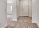 Welcoming entryway showcasing a pristine white door, tile flooring, and a neutral color scheme, inviting guests inside at 6800 Dunlin Ct, Sarasota, FL 34241
