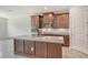 Stylish kitchen featuring stainless steel appliances, granite countertops, and a central island at 6800 Dunlin Ct, Sarasota, FL 34241