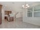 Open-concept kitchen featuring granite countertop, wood cabinets, and access to the dining area at 6800 Dunlin Ct, Sarasota, FL 34241