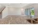 Open-concept living space with granite countertop, stainless steel sink and access to the living room at 6800 Dunlin Ct, Sarasota, FL 34241