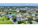 Expansive aerial view showcases various recreational facilities, including tennis courts and a pool at 752 White Pine Tree Rd # 101, Venice, FL 34285