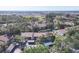 Scenic aerial view of the community, highlighting its lush landscaping, pond, and surrounding greenery at 752 White Pine Tree Rd # 101, Venice, FL 34285