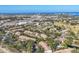 Expansive aerial shot of the community with views of the city and coastal waterway at 752 White Pine Tree Rd # 101, Venice, FL 34285