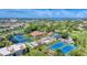 Beautiful aerial view showcasing community amenities like pools and tennis courts at 752 White Pine Tree Rd # 101, Venice, FL 34285