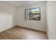 Bright bedroom featuring updated flooring and a large window with natural light at 752 White Pine Tree Rd # 101, Venice, FL 34285