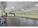 Bright exercise room with a full-length mirror and equipment, ideal for fitness and wellness activities at 752 White Pine Tree Rd # 101, Venice, FL 34285