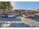 Condo exterior featuring covered parking, well-maintained landscaping, and convenient access to units at 752 White Pine Tree Rd # 101, Venice, FL 34285