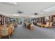 Community library showcasing bookshelves, seating, and natural light at 752 White Pine Tree Rd # 101, Venice, FL 34285