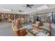 Cozy library with bookshelves, tables and chairs, perfect for reading and relaxation at 752 White Pine Tree Rd # 101, Venice, FL 34285