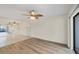 Living room with hardwood floors, ceiling fan and lots of natural light at 752 White Pine Tree Rd # 101, Venice, FL 34285