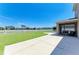 Expansive backyard with a concrete path leading to a screened lanai, perfect for outdoor enjoyment at 7822 110Th E Ave, Parrish, FL 34219