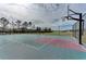 Community basketball court with benches, a fence, and pretty landscaping at 7822 110Th E Ave, Parrish, FL 34219