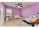 Bright bedroom features a ceiling fan, ample natural light and a comfortable bed at 7822 110Th E Ave, Parrish, FL 34219