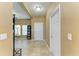 The home foyer features neutral walls and tile flooring, creating a bright and welcoming entrance at 7822 110Th E Ave, Parrish, FL 34219