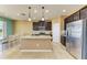 Well-equipped kitchen featuring a granite island, stainless steel appliances, and dark wood cabinetry at 7822 110Th E Ave, Parrish, FL 34219