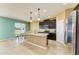 Modern kitchen with stainless steel appliances, granite countertops, and island with pendant lighting at 7822 110Th E Ave, Parrish, FL 34219