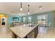 Stylish kitchen island with granite countertops, stainless steel dishwasher, and open view to the living area at 7822 110Th E Ave, Parrish, FL 34219