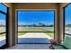Enjoy this screened lanai featuring serene views of the grassy lawn and tranquil lake at 7822 110Th E Ave, Parrish, FL 34219