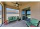The screened lanai boasts comfortable seating and a ceiling fan, perfect for relaxation at 7822 110Th E Ave, Parrish, FL 34219