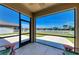 The lanai features an expansive view of a lake and manicured green lawn at 7822 110Th E Ave, Parrish, FL 34219