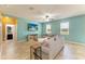 Spacious living room with an open layout, TV, and comfortable seating, adjacent to kitchen at 7822 110Th E Ave, Parrish, FL 34219