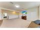 Large living area with tv, neutral paint, carpet flooring and ample natural light at 7822 110Th E Ave, Parrish, FL 34219