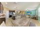 Open-concept living space featuring a kitchen with granite countertops, a dining area, and comfortable living room at 7822 110Th E Ave, Parrish, FL 34219