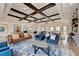 Spacious lounge area with elegant wooden ceiling beams, offering comfortable seating arrangements and stylish decor at 7822 110Th E Ave, Parrish, FL 34219